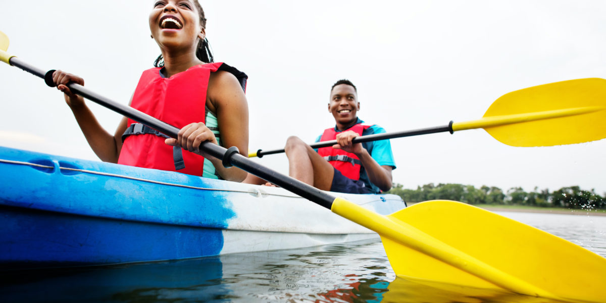 Ocean literacy and conservation behavior change: two people canoeing in a lake