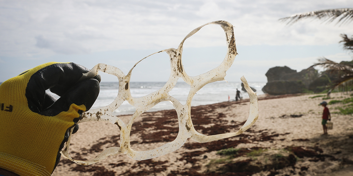 Plastic soda can rings on beach