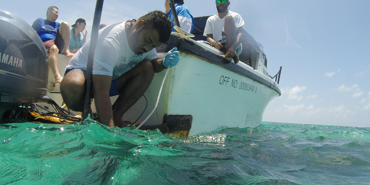 Scientist at our Ocean Acidification Monitoring Workshop in Fiji collecting water samples