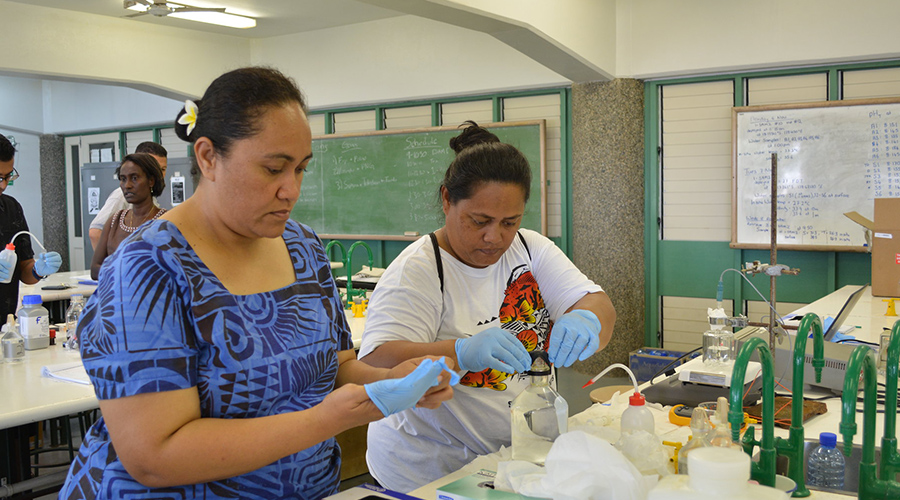 Scientists monitor pH of water in a lab in Fiji