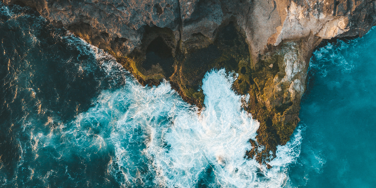 Ocean cliff crashing waves