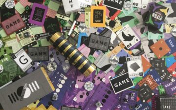 Image of various games cards, dice and packaging.