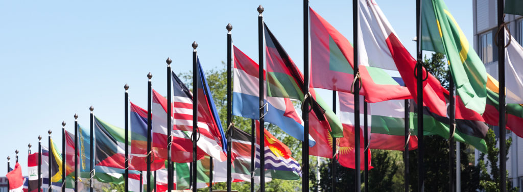 Global Agreements page: colorful country flags in a row