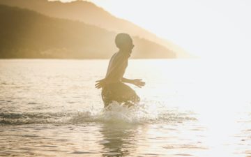 Community Benefits: Little boy in the ocean