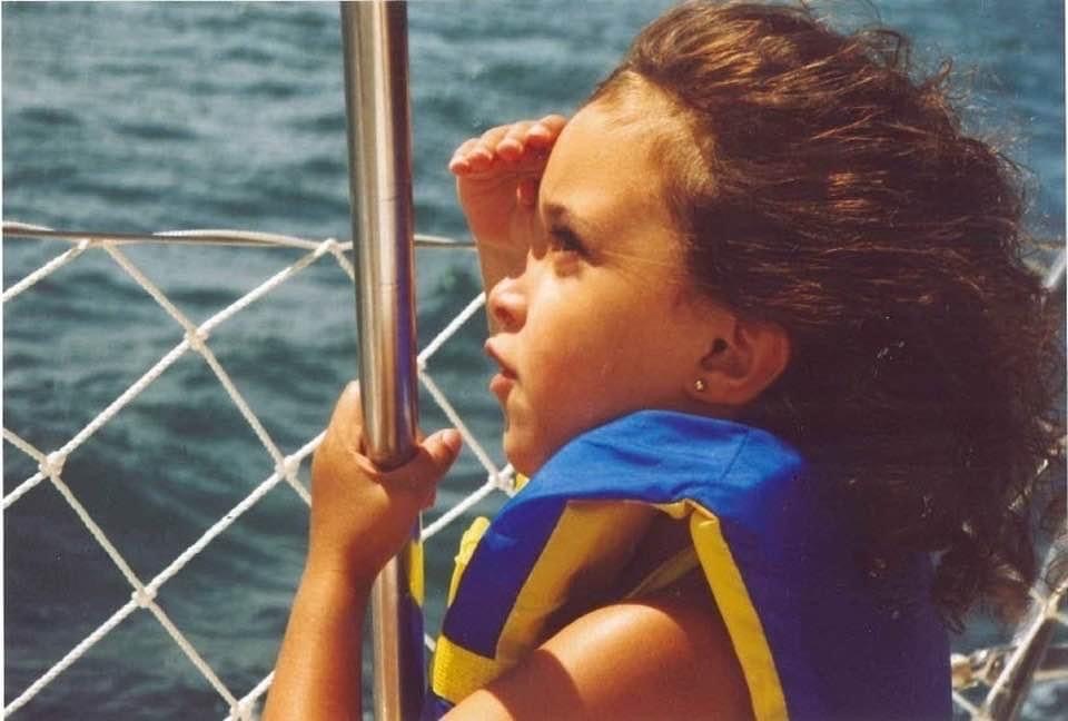 Lily as a child looking out into the water 
