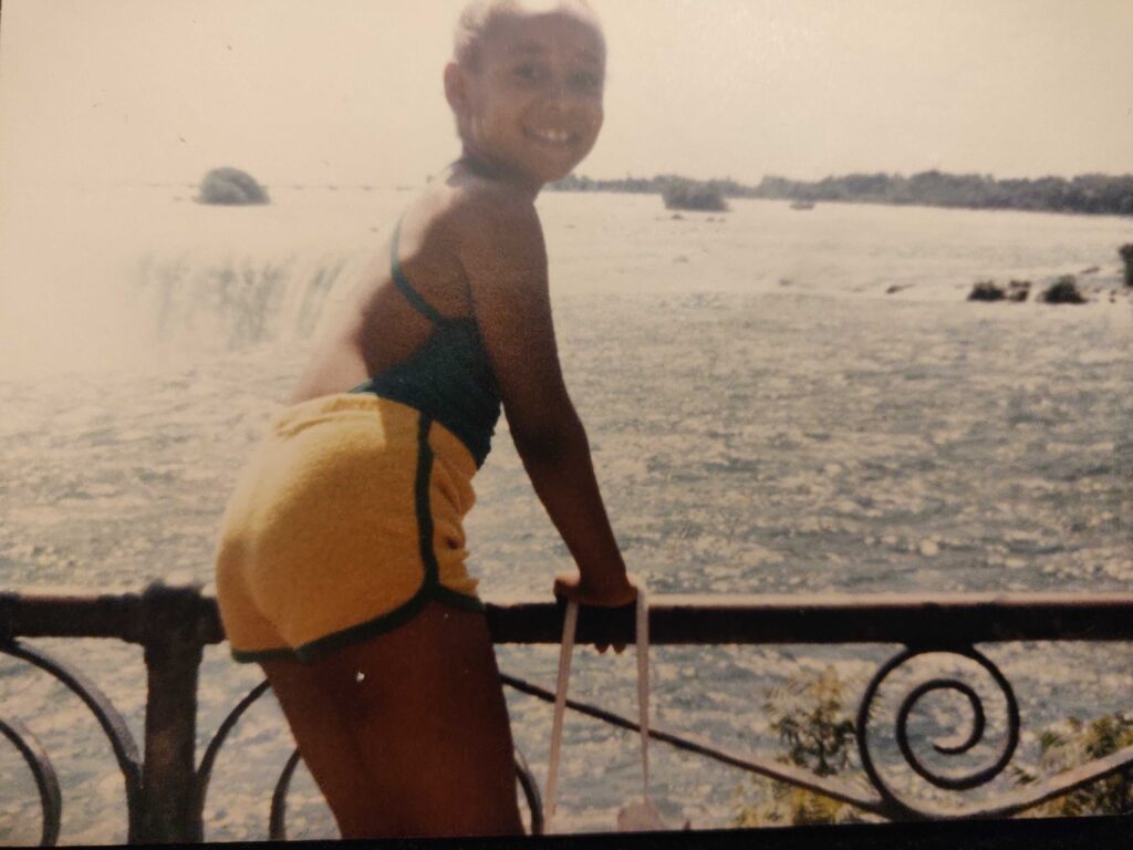 Tamika as a child, looking out at Niagra Falls