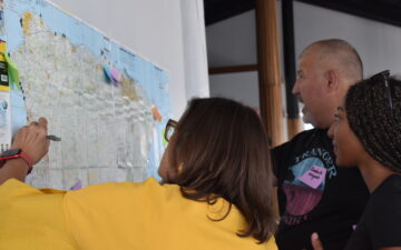 Puerto Rico workshop participants writing on a map on the wall