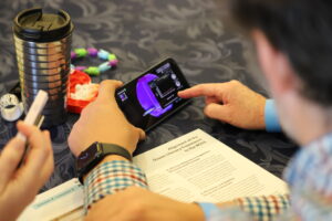 Educators Summit participants exploring the Science on a Sphere app