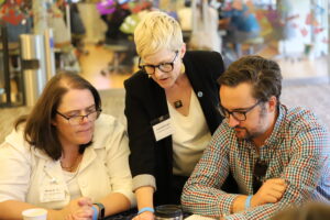 Carrie McDougall shows Educators Summit participants the inner workings of the new Science on a Sphere app