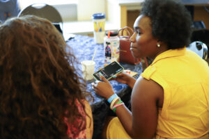 Educators Summit participants exploring the Science on a Sphere app