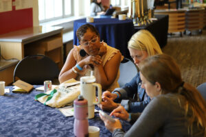 Educators Summit participants exploring the Science on a Sphere app