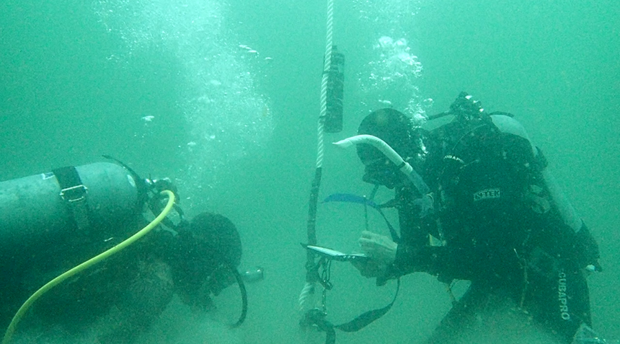 Divers working underwater