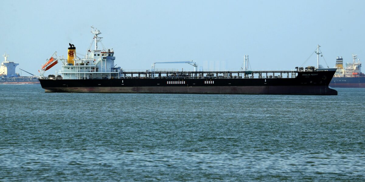 Large tanker in the distance.